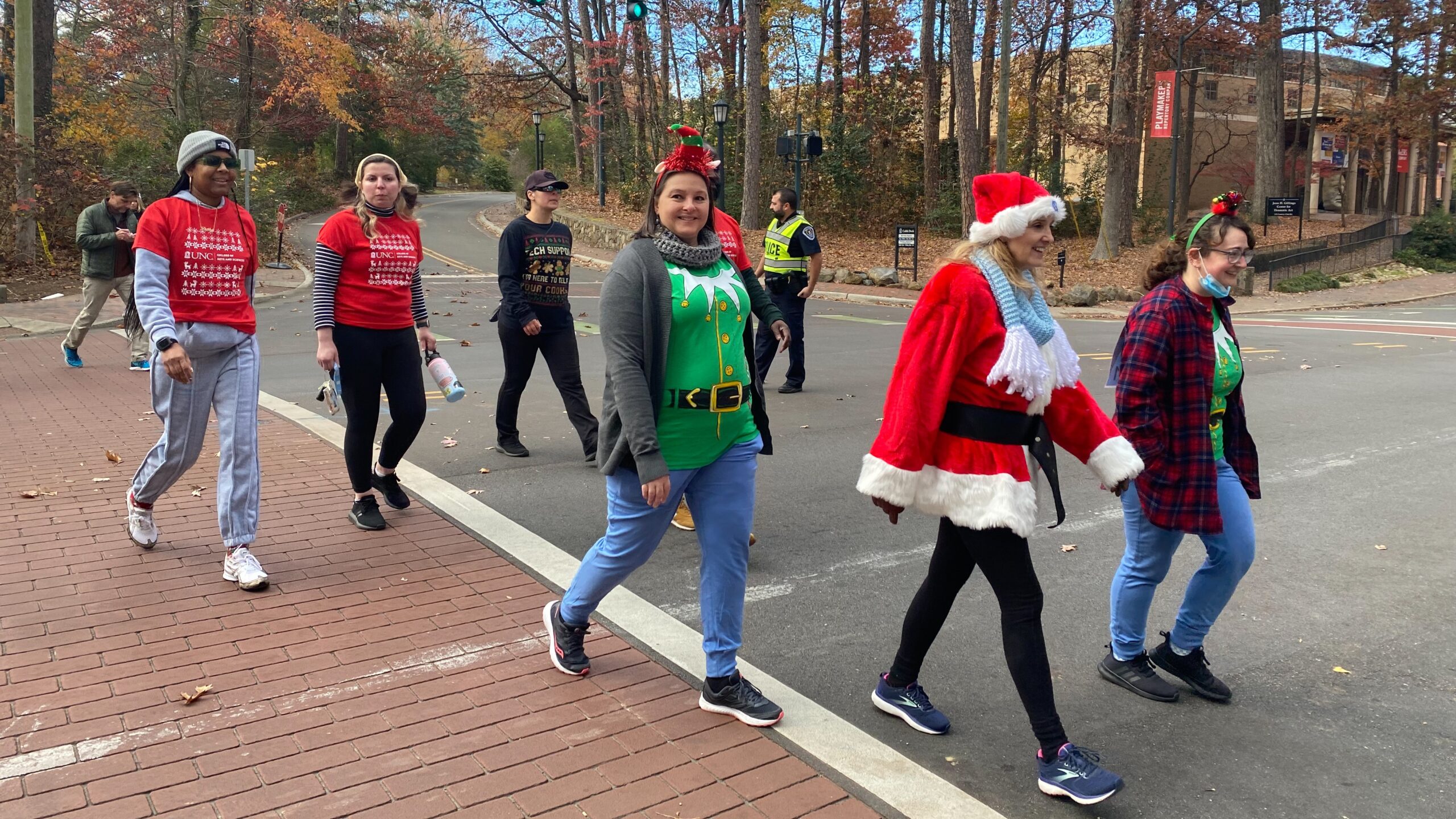 UNC Chapel Hill employees participate in the Jingle Bell Jog 2022 dressed in festive outfits
